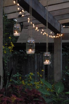 Create inexpensive, home-made garden lanterns with some twine, a few Mason or Ba