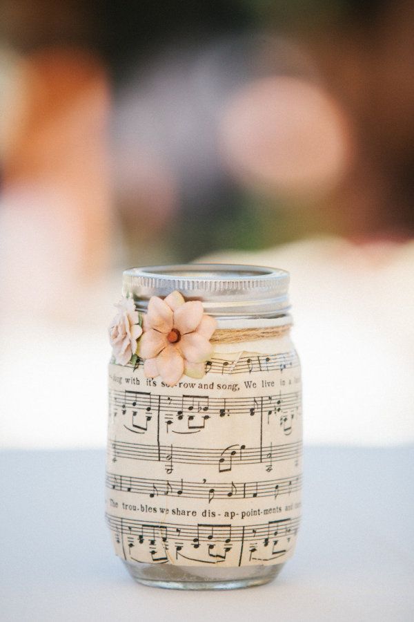 Sheet music on mason jars. Light a candle inside at night, and the music glows!