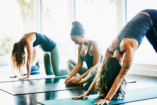 Group of women stretching before yoga class in studio - Group of women stretching before yoga class in studio -   17 group fitness Photography ideas