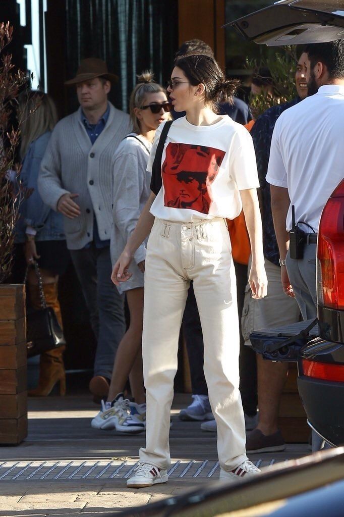 Kendall JennerOutfit Look in White Pants. Street Style 2019 Oversized Solid Beige Cotton Trousers Oversized White Graphic Tee Round White Adidas Crisscross Tie Sneakers on SASSY DAILY - Kendall JennerOutfit Look in White Pants. Street Style 2019 Oversized Solid Beige Cotton Trousers Oversized White Graphic Tee Round White Adidas Crisscross Tie Sneakers on SASSY DAILY -   17 kendall jenner style Street ideas